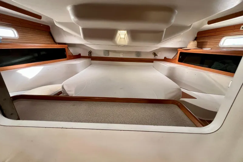 Slide: The Image of Interior cabin of a 1996 Catalina 400 sailboat, featuring a cozy sleeping area. - 73