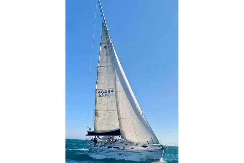 Slide: The Image of Sailing yacht Catalina 400, 1996 model, gliding on open sea under clear blue sky. - 8