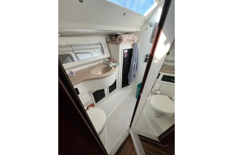 Slide: The Image of Bathroom interior of a 1996 Catalina 400 yacht, featuring sink and toilet. - 81
