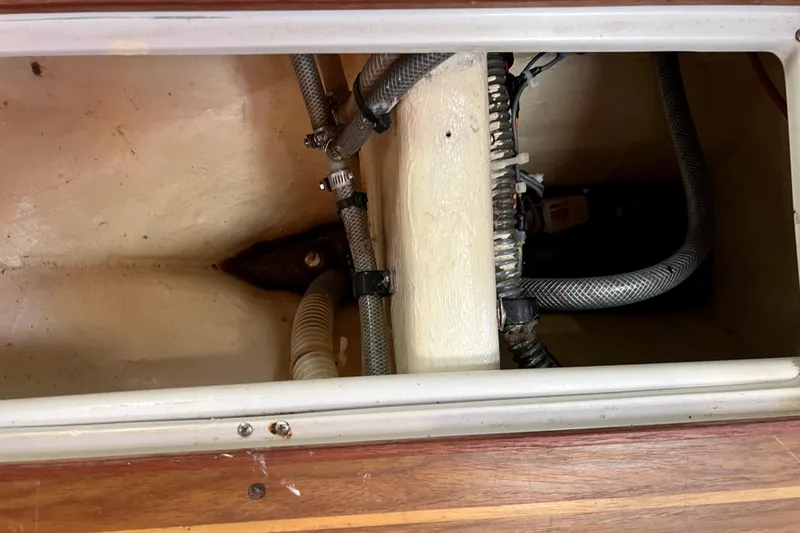Slide: The Image of Interior view of a 1996 Catalina 400 sailboat showing wiring and hoses. - 85