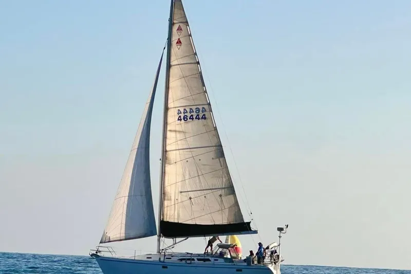 Slide: The Image of Sailing yacht Catalina 400, 1996 model, cruising on open sea with full sails. - 9