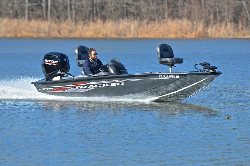 The Image of 2022 Bass Tracker 175 TF boat speeding on a lake with a Mercury engine. - 1
