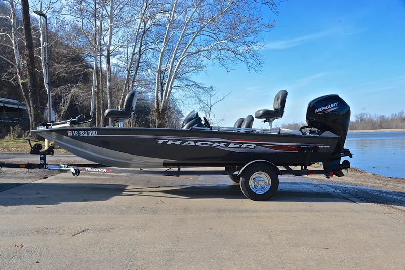 Slide: The Image of 2022 Bass Tracker 175 TF boat on trailer by a lake, ready for fishing. - 11