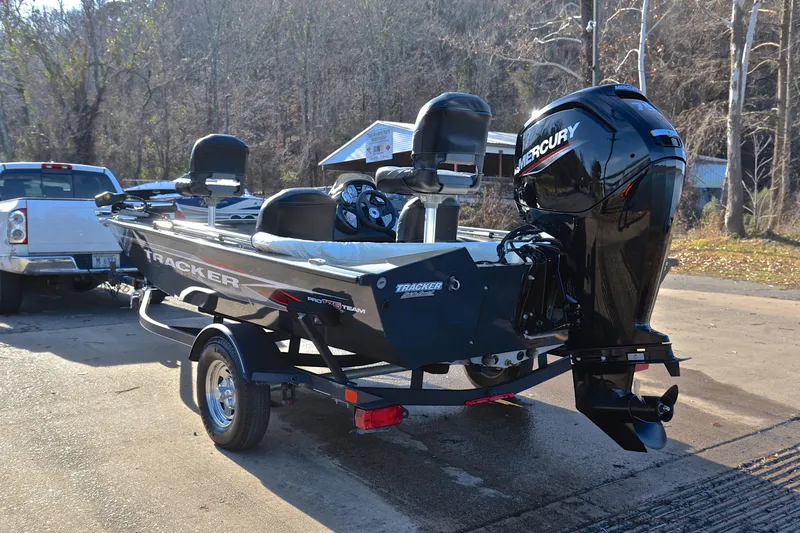 Slide: The Image of 2022 Bass Tracker 175 TF boat with Mercury engine on trailer in outdoor setting. - 12