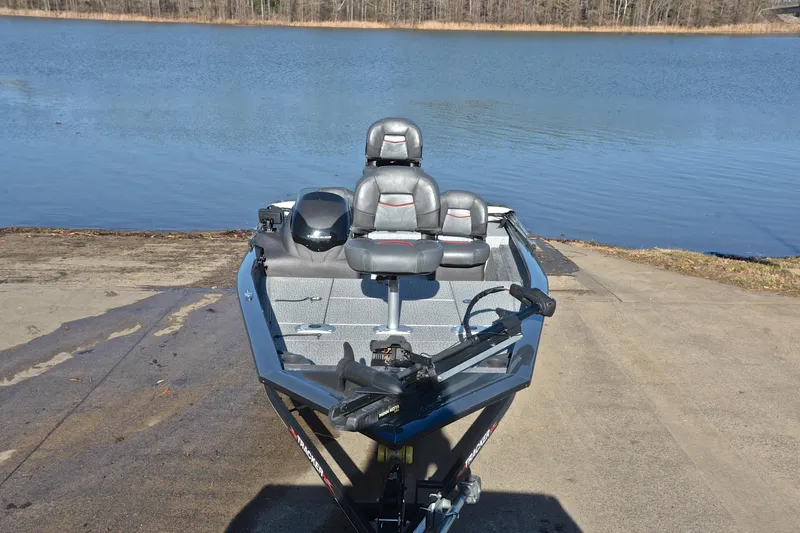 Slide: The Image of 2022 Bass Tracker 175 TF boat at a lakeside launch ramp. - 17