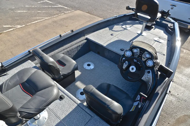 Slide: The Image of 2022 Bass Tracker 175 TF boat interior with steering console and seating. - 20