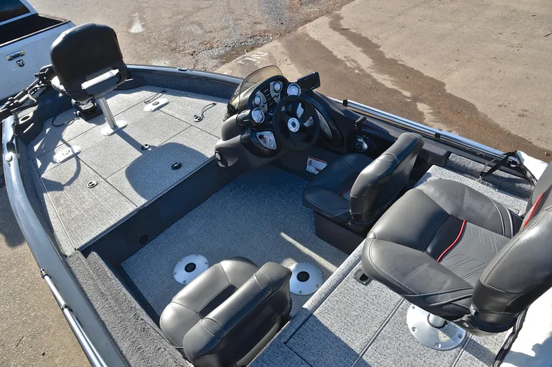 Slide: The Image of 2022 Bass Tracker 175 TF boat interior with seating and steering console. - 21
