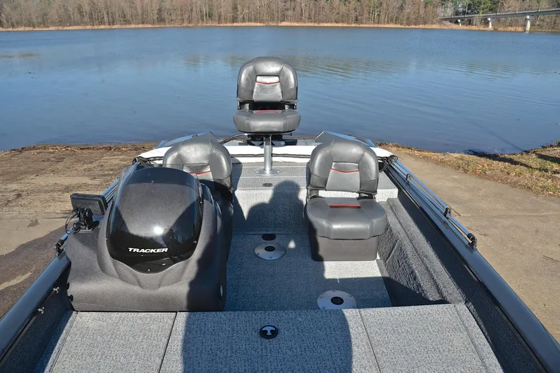 Slide: The Image of 2022 Bass Tracker 175 TF boat on a lake, featuring comfortable seating and sleek design. - 22