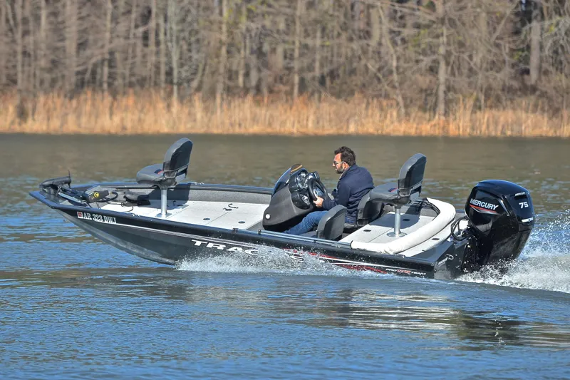 Slide: The Image of 2022 Bass Tracker 175 TF boat cruising on a lake with a Mercury 75 engine. - 6