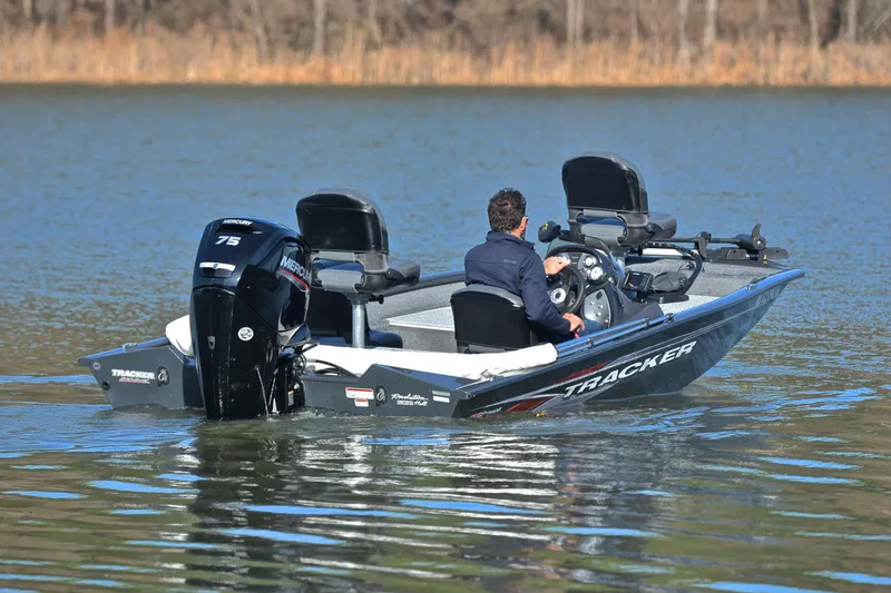 Slide: The Image of 2022 Bass Tracker 175 TF boat on a lake, featuring a Mercury 75 engine. - 8
