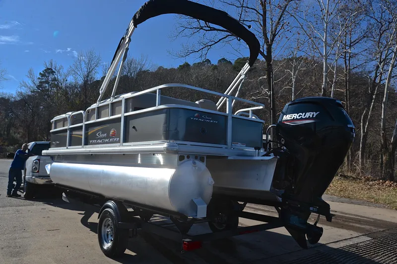Slide: The Image of 2025 Sun Tracker Party Barge 18 DLX pontoon boat on trailer with Mercury engine. - 12