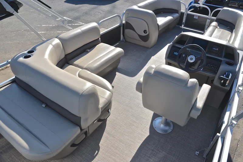 Slide: The Image of 2025 Sun Tracker Party Barge 18 DLX interior with spacious seating and modern helm. - 19