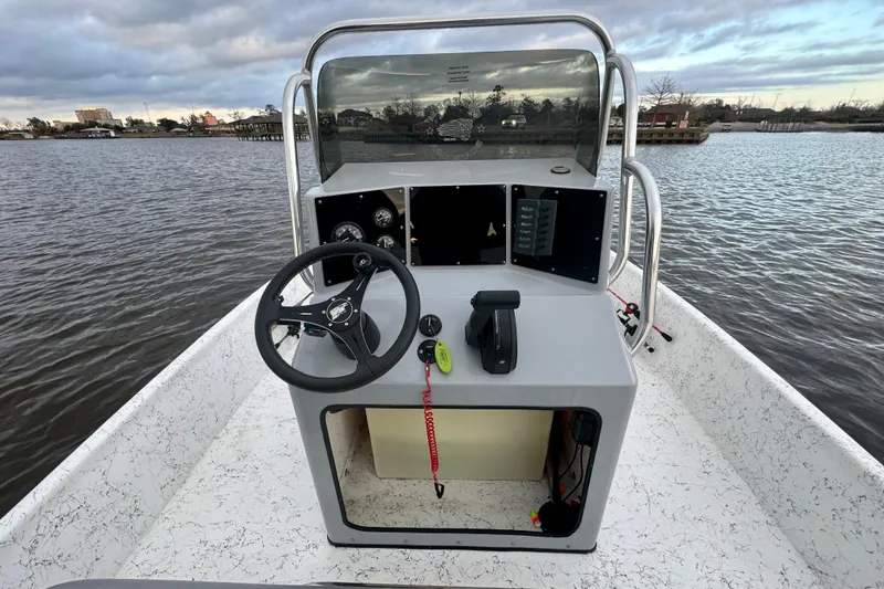 Slide: The Image of Interior view of 2025 Freedom Boats 18' Patriot on the water. - 21