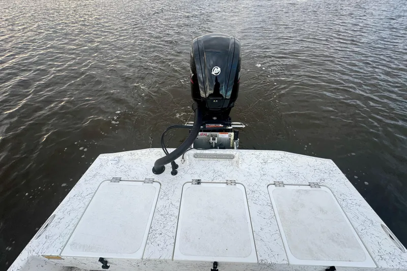 Slide: The Image of Rear view of a 2025 Freedom Boats 18' Patriot on the water. - 27