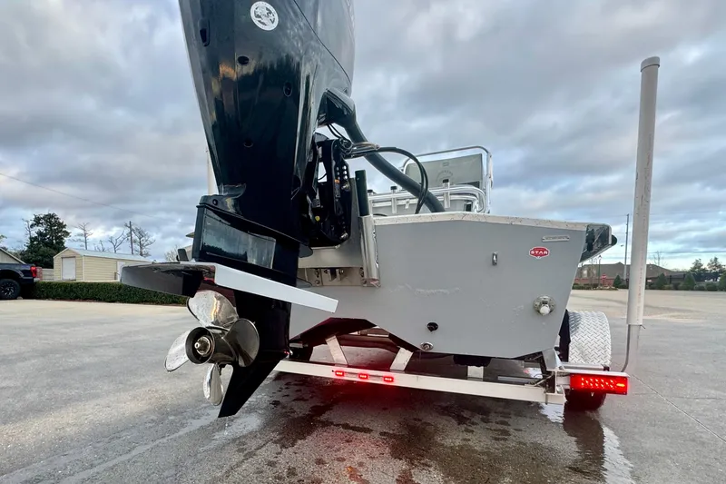 Slide: The Image of Rear view of 2025 Freedom Boats 18' Patriot on trailer. - 16