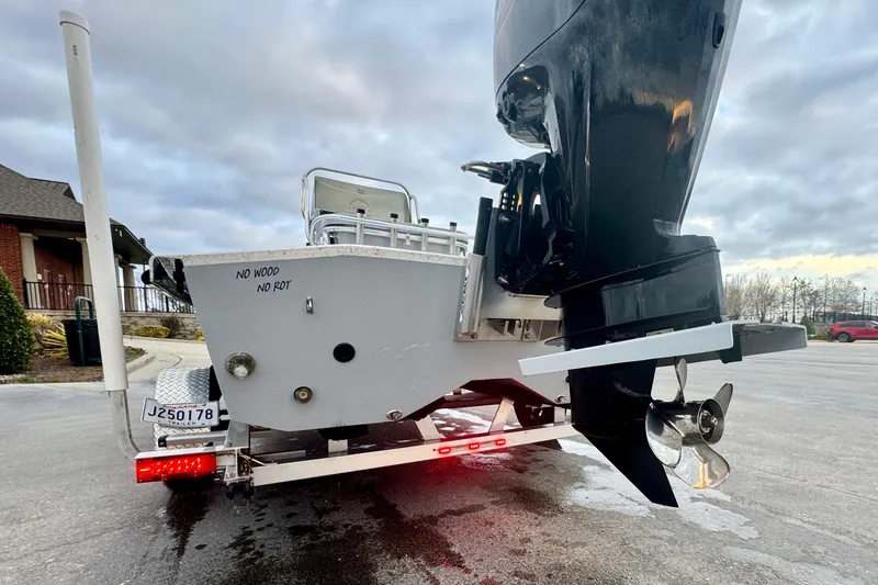 Slide: The Image of Rear view of a 2025 Freedom Boats 18' Patriot on trailer. - 17