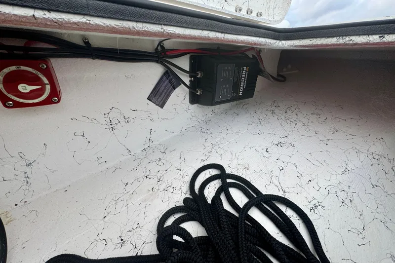 Slide: The Image of Interior of 2025 Freedom Boats 18' Patriot with ropes and switch. - 26