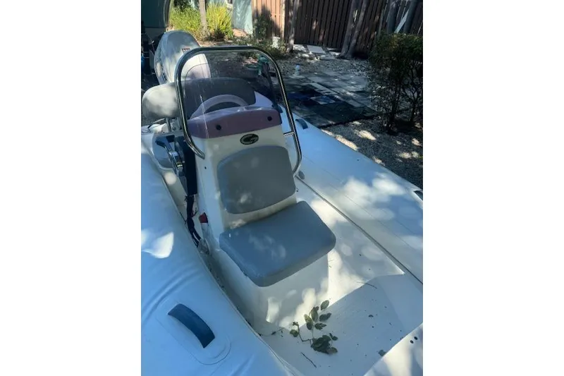 Slide: The Image of 2022 Grand Marine S370 inflatable boat with steering console, parked outdoors. - 3