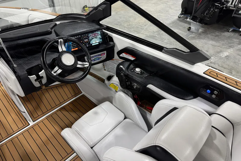 Slide: The Image of 2019 Nautique Super Air Nautique G23 cockpit with modern controls and luxurious seating. - 12