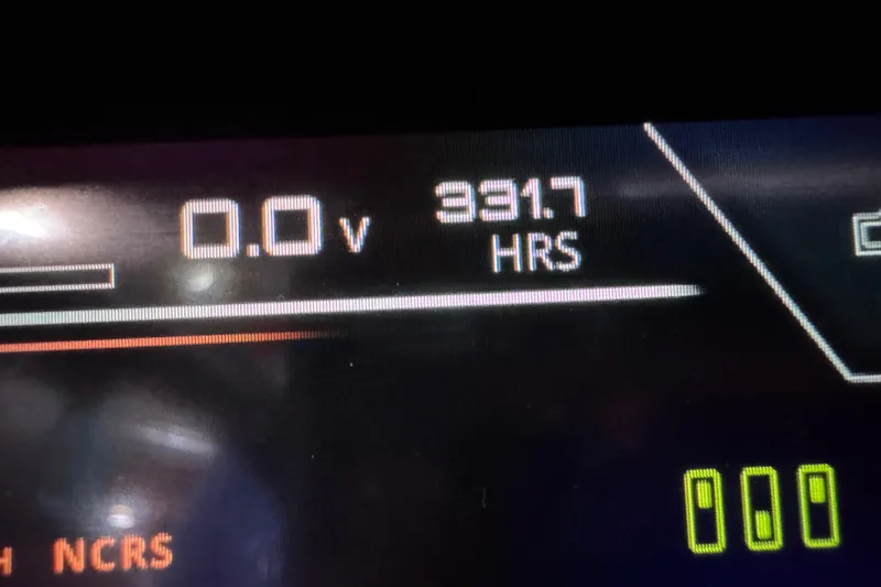 Slide: The Image of Close-up of 2019 Nautique Super Air Nautique G23 dashboard showing 391.7 hours. - 13