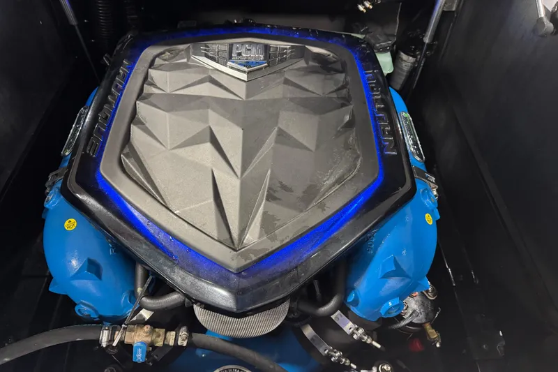 Slide: The Image of 2019 Nautique Super Air Nautique G23 engine with blue accents and PCM branding. - 14