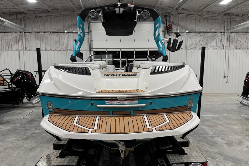 Slide: The Image of 2019 Nautique Super Air Nautique G23 boat in a storage facility. - 6