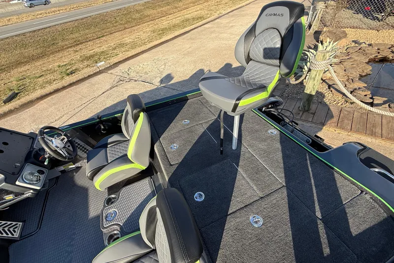 Slide: The Image of 2021 Caymas CX 21 boat interior with stylish seating and modern dashboard. - 12