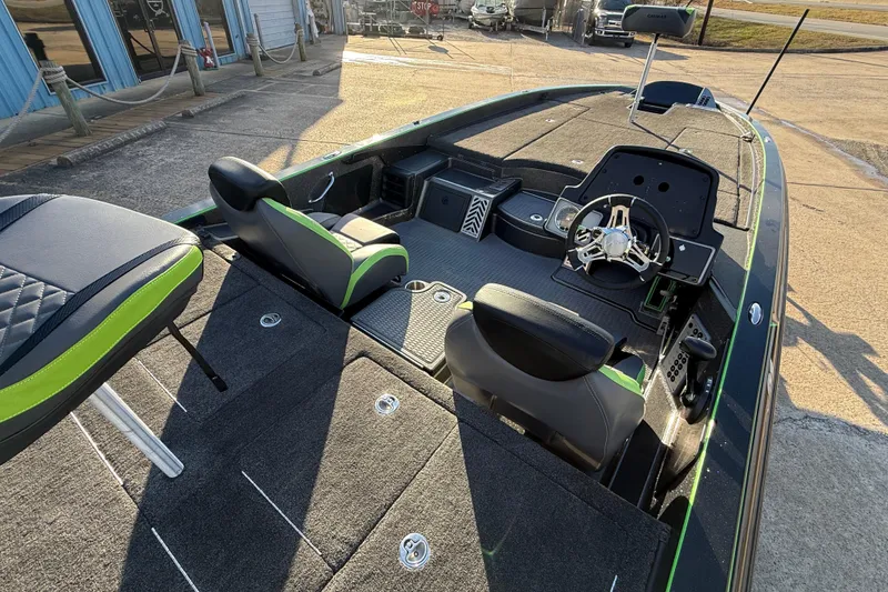 Slide: The Image of 2021 Caymas CX 21 boat interior with modern seating and steering wheel. - 13