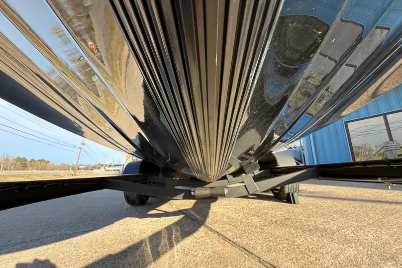 Slide: The Image of Underneath view of a 2021 Caymas CX 21 boat on a trailer. - 7