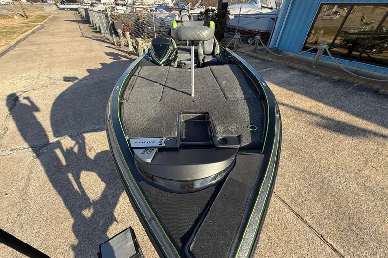 Slide: The Image of 2021 Caymas CX 21 boat with spacious deck, parked outdoors. - 8