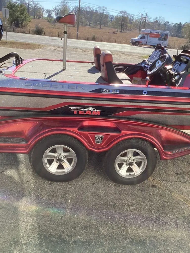 Slide: The Image of 2018 Skeeter FX21 boat with open storage compartment lid. - 47