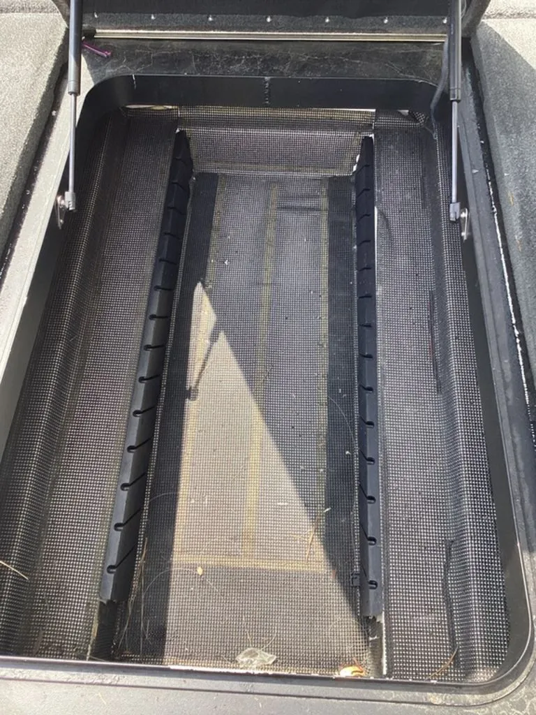 Slide: The Image of Interior view of a 2018 Skeeter FX21 boat storage compartment. - 48