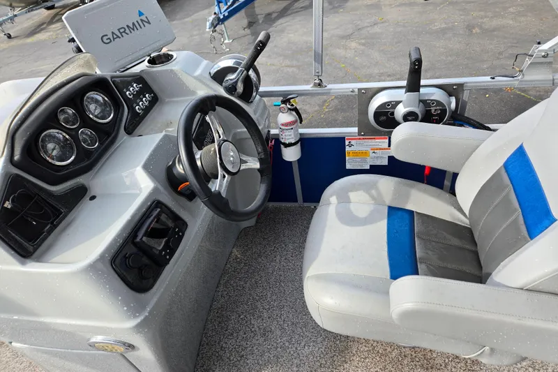 Slide: The Image of 2020 Lowe SF 232 Sport Fish boat cockpit with Garmin navigation and comfortable seating. - 12