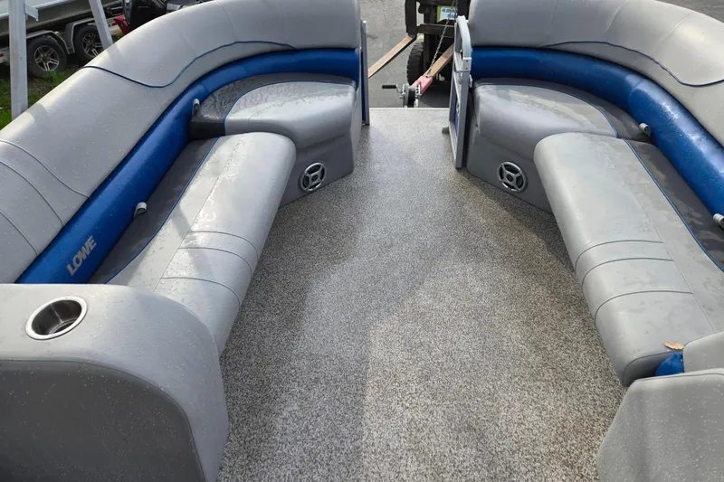Slide: The Image of 2020 Lowe SF 232 Sport Fish boat interior with gray and blue seating. - 13