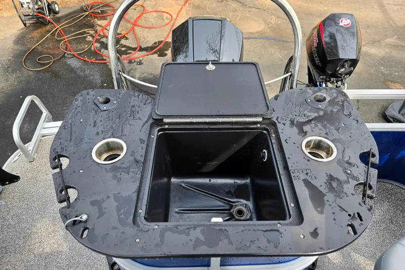 Slide: The Image of 2020 Lowe SF 232 Sport Fish boat with open storage compartment and cup holders. - 6