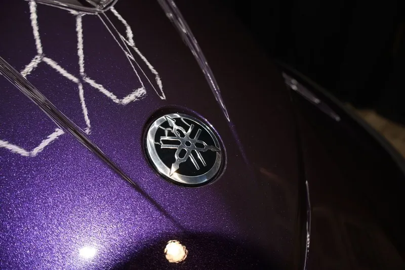 Slide: The Image of Close-up of Yamaha WaveRunners VX® 2026 logo on purple surface. - 8