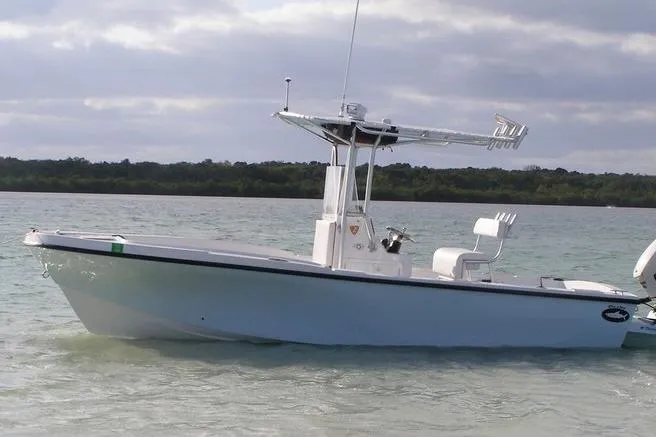 The Image of 2025 Dusky 227 boat on calm water with overcast sky. - 1