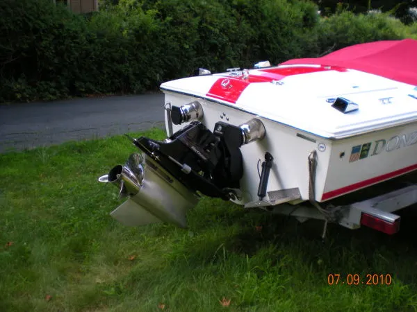 Slide: The Image of Rear view of a 2008 Donzi 18 Classic boat on grass. - 1