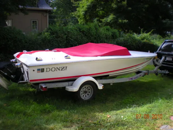 Slide: The Image of 2008 Donzi 18 Classic boat with red cover on trailer. - 2