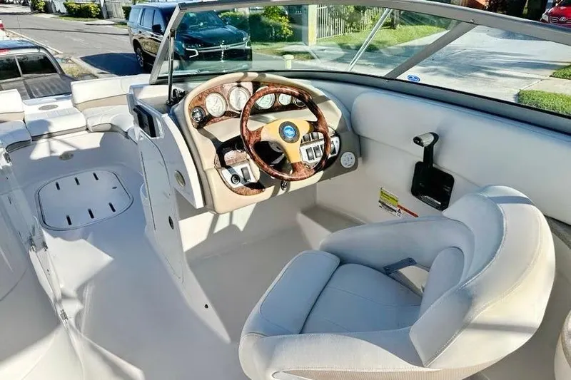 Slide: The Image of 2005 Four Winns 264 Funship boat interior with steering wheel and seating. - 20