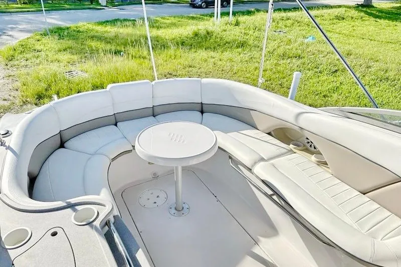 Slide: The Image of 2005 Four Winns 264 Funship boat interior with circular seating and table. - 22