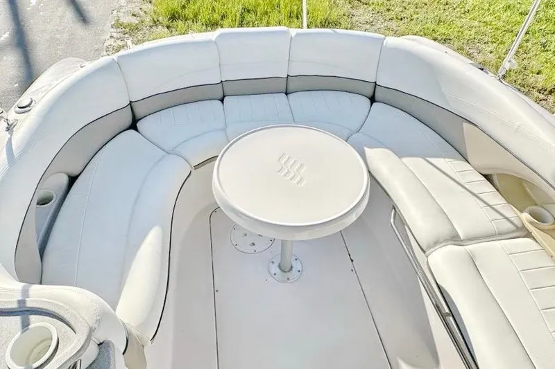 Slide: The Image of 2005 Four Winns 264 Funship boat interior with circular seating and table. - 23