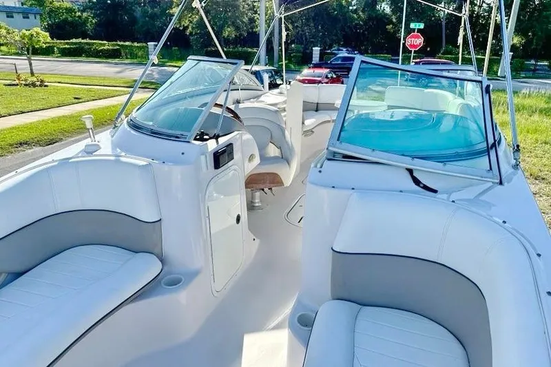 Slide: The Image of 2005 Four Winns 264 Funship boat interior with white seating and windshield. - 26