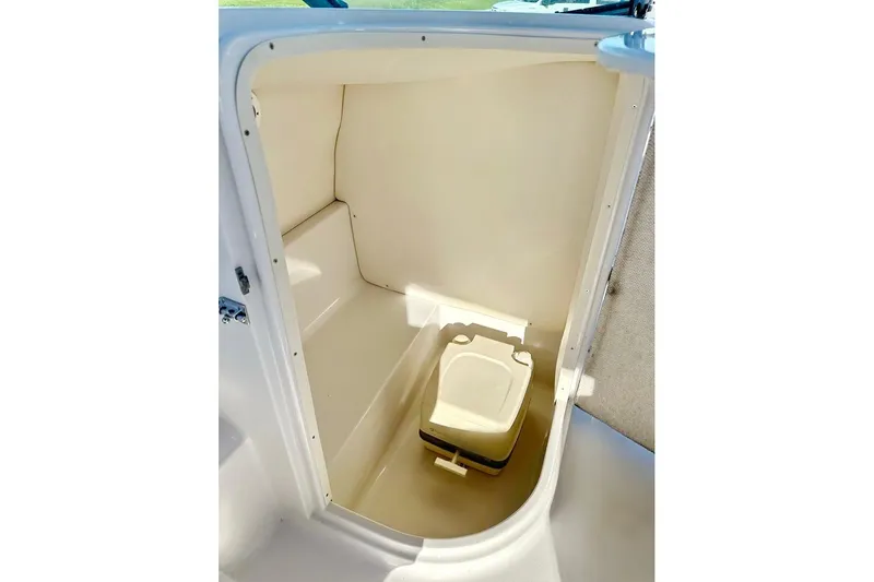 Slide: The Image of 2005 Four Winns 264 Funship boat interior with compact portable toilet. - 27