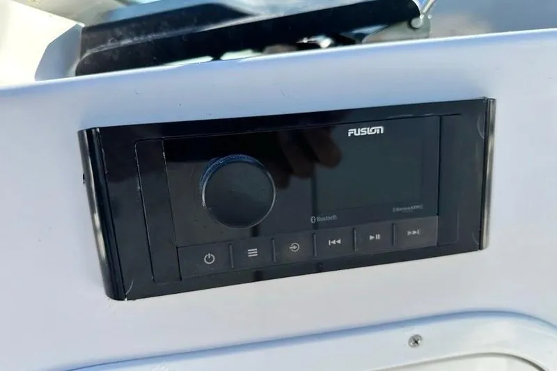 Slide: The Image of Fusion audio system on 2005 Four Winns 264 Funship boat dashboard. - 28