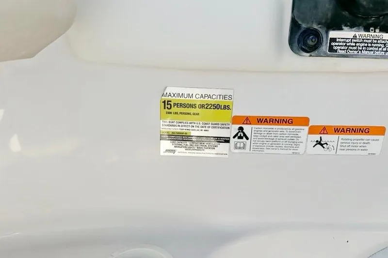 Slide: The Image of 2005 Four Winns 264 Funship capacity label, maximum 15 persons or 2250 lbs, with warnings. - 29