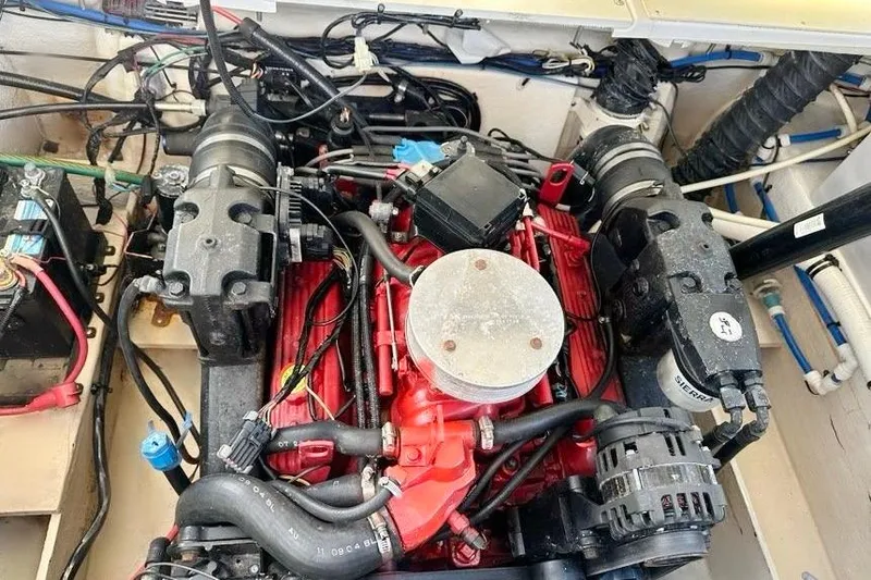 Slide: The Image of Engine compartment of a 2005 Four Winns 264 Funship boat, showcasing detailed components. - 30