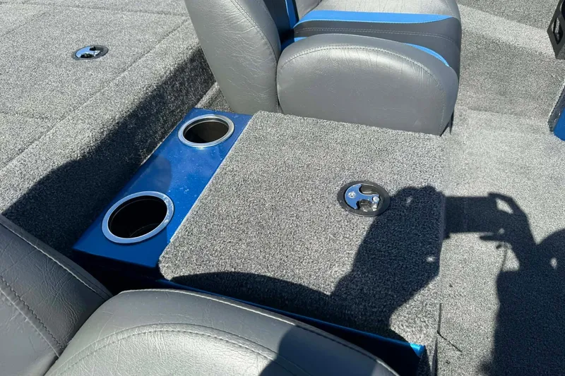 Slide: The Image of 2026 Vexus Defender 189 interior with cup holders and gray seating. - 6