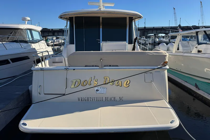 Slide: The Image of 2023 Sabre 48 Salon Express yacht docked at Wrightsville Beach, NC. - 1