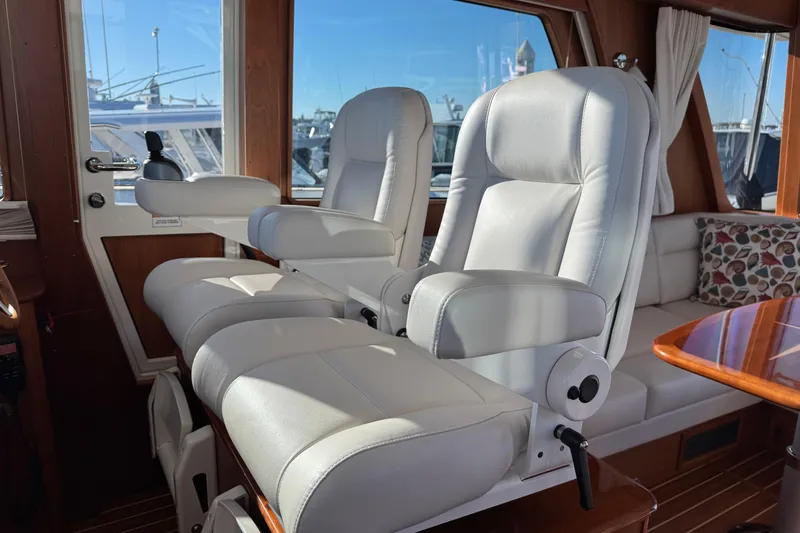 Slide: The Image of Luxurious interior of 2023 Sabre 48 Salon Express with plush seating and wooden accents. - 12